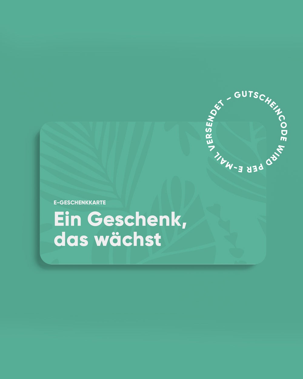 Ein grüner E-Gutschein mit tropischem Blattmuster und dem deutschen Text „Ein Geschenk, das wächst“. Auf dem E-Gutschein ist vermerkt, dass die E-Geschenkkarte und der Code per E-Mail versendet werden.